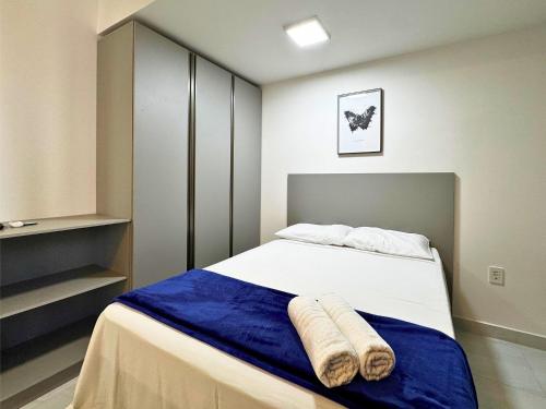 a bedroom with a bed with two towels on it at Compact Time by Holiday Stays in João Pessoa