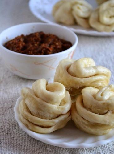 a plate of food with donuts and a bowl of chili at Stargazing Homestay Nako in Nako