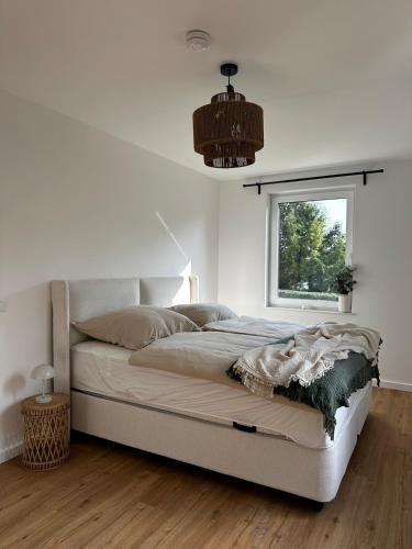 Postel nebo postele na pokoji v ubytování Ferienwohnung an der Windmühle