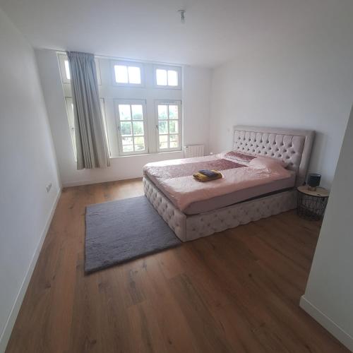 Giường trong phòng chung tại Super cozy appartement