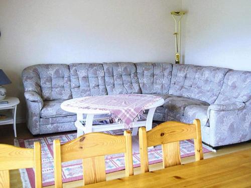 a living room with a couch and a table at 4 person holiday home in Byxelkrok-By Traum in Byxelkrok