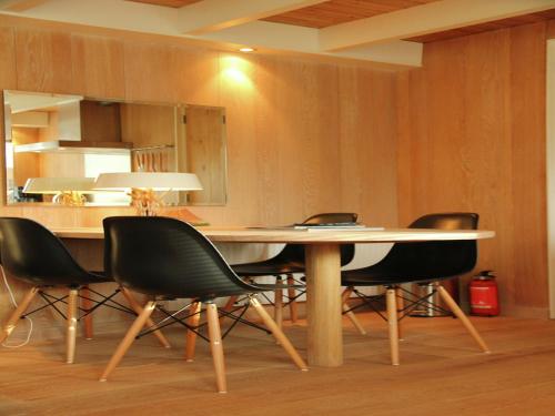 a dining room with a table and chairs at Apartment in Heiloo near North Sea Beach in Heiloo
