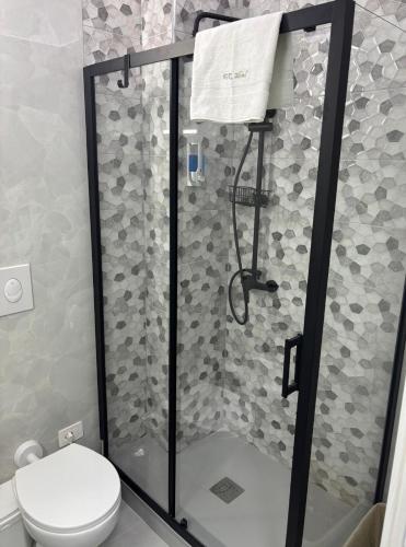 a bathroom with a shower with a toilet at FaZi Home in Cosenza