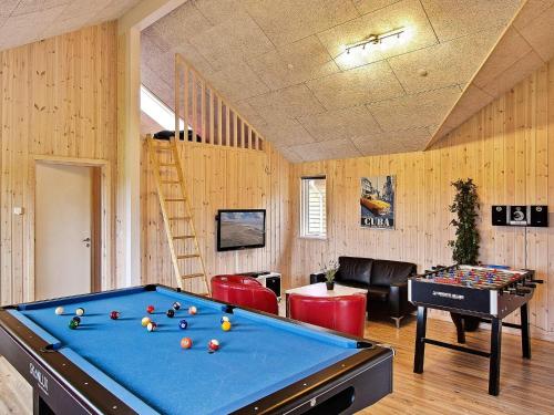 a room with a pool table and a staircase at Luxury Pool Retreat in Nordborg - By Traum Ferienwohnungen in Nordborg