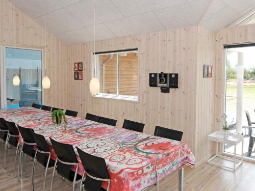 a large dining room with a table and chairs at Luxury Pool Retreat in Nordborg - By Traum Ferienwohnungen in Nordborg