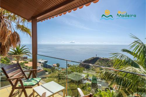 a balcony with a view of the ocean at OurMadeira - Vista Grande in Caniço