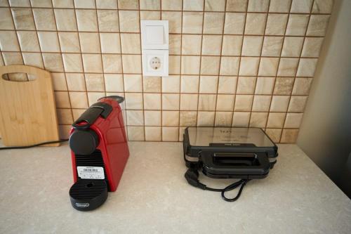 a blender and a toaster sitting on a kitchen counter at Skye urban oasis in Tripolis