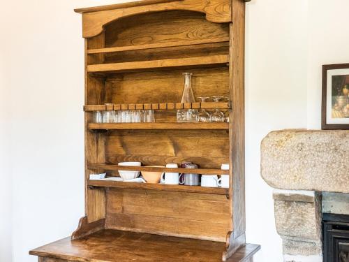 a wooden shelf in a living room at Relaxing Family Stay in Les Vans in Chambonas