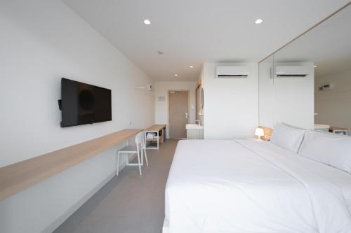 Lis Hotel Chiangmaiにあるベッド