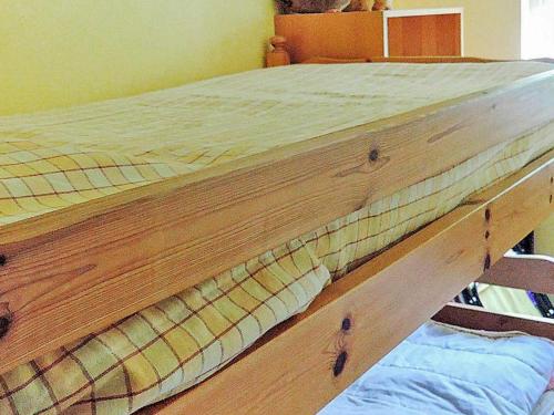 a wooden bed frame with a mattress on it at 6 person holiday home in HÄSTVEDA-By Traum in Hästveda
