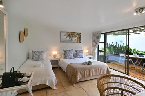 Ένα ή περισσότερα κρεβάτια σε δωμάτιο στο BonBini Guest House