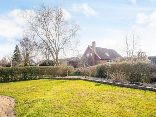 a large yard with a house in the background at Tranquil Haven in Ansager - By Traum Ferienwohnungen in Ansager