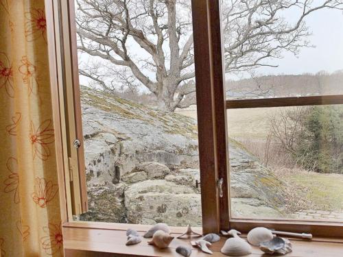 a window with a view of a tree at 5 person holiday home in ASKERÖARNA-By Traum in Buvik