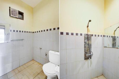 a bathroom with a toilet and a shower at Ken Hotel by Tripletree in Sampal 2
