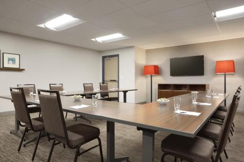 a conference room with a large table and chairs at Country Inn & Suites by Radisson Asheville River Arts District in Asheville
