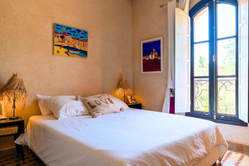 Cama o camas de una habitación en Riad Khiata