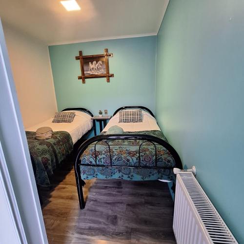 Postel nebo postele na pokoji v ubytování Hostel Kuntur