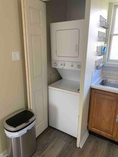 a small kitchen with a sink and a microwave at Day Street - Walk to Harpers Ferry NP in Bolivar
