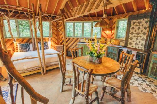 a bedroom with a table and a bed in a room at West Lexham Retreat in Kings Lynn