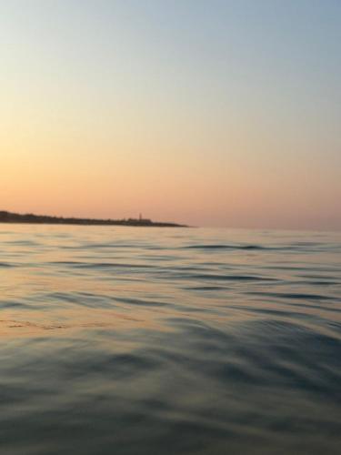 a view of the ocean at sunset at haska home in Sampieri