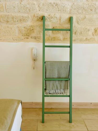 a green bunk bed in a room with a wall at A Casa del Console apartment in Manfredonia