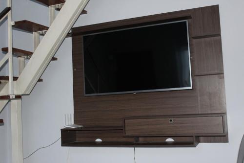 Duplex c/AR 2 quartos próximo de tudo - Ipatingaにあるテレビまたはエンターテインメントセンター