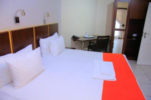 Ένα ή περισσότερα κρεβάτια σε δωμάτιο στο Selepa Hotel Bw