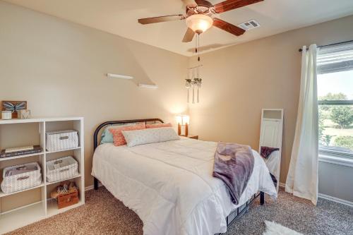 a bedroom with a bed and a ceiling fan at Trail Access and Patio Peaceful Tulsa Area Retreat in Claremore