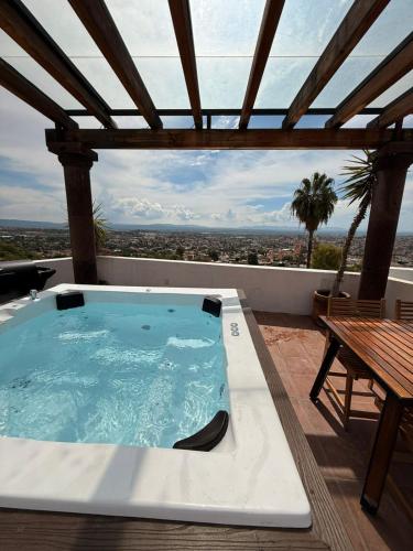 a hot tub on the roof of a house at LUXO Casa en San Miguel de Allende Centro con Vistas Panorámicas in San Miguel de Allende