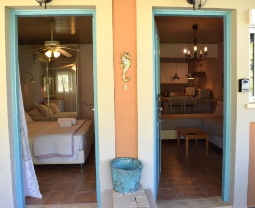 a room with a bedroom with a bed and a door at Simatos αpARTments & Studios in Lassi