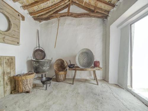 a room with a table and baskets and a window at Holiday Home in Villanueva near El Terril Peak in Villanueva de San Juan