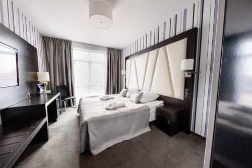 Ένα ή περισσότερα κρεβάτια σε δωμάτιο στο Hotel Grafit