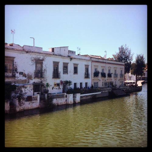 a building on the side of a river at Al-Gharb Tavira Eco GuestHouse in Tavira
