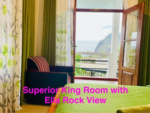 a living room with a chair and a window at The Rock Face in Ella