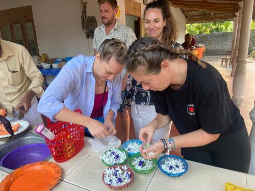 a group of people standing around a table making cupcakes at Moonshade Handapanagala in Monaragala
