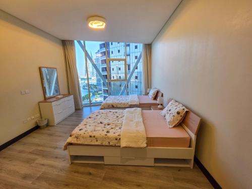 Ένα ή περισσότερα κρεβάτια σε δωμάτιο στο Iconic Stay Four Seasons View
