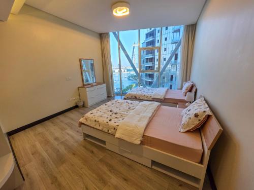 Ένα ή περισσότερα κρεβάτια σε δωμάτιο στο Iconic Stay Four Seasons View