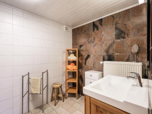 a small kitchen with a sink and a counter at Charming Nieuwpoort Mill Retreat in Zottegem