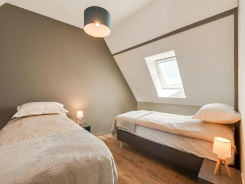 a bedroom with two beds and a window at Apartment in Dambach near Vineyards in Dambach-la-Ville