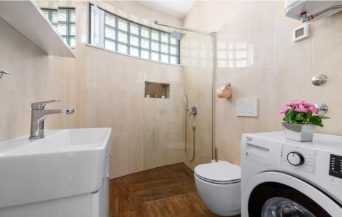 a bathroom with a toilet and a sink and a shower at Istrian Azure in Pula