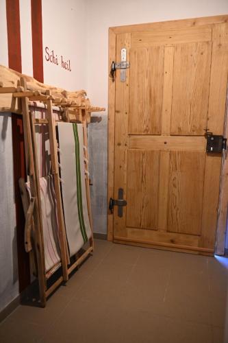 a room with a pair of wooden doors at Chalet - Apartment - Mit Liebe dekoriert in Öblarn