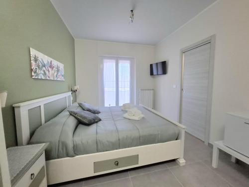 a bedroom with a bed with a teddy bear on it at La Casa nel Parco in Moncalieri