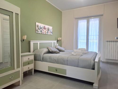 a bedroom with a bed and a window at La Casa nel Parco in Moncalieri