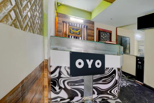 a lobby with a sign that reads ovo at Hotel O Royal Inn in Mumbai