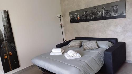 a bed with two pillows on it in a room at La Casa nel Parco in Moncalieri