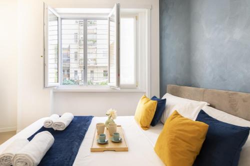 Ένα ή περισσότερα κρεβάτια σε δωμάτιο στο Easylife - Milano - Aurispa 2 - Navigli