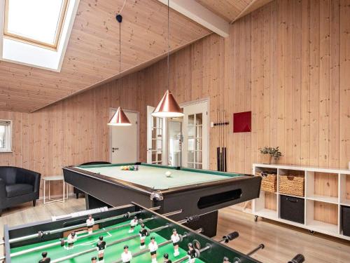 a room with a pool table in a house at 14 person holiday home in Højslev in Sundstrup