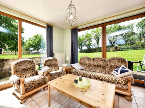 Un lugar para sentarse en Holiday Home in St Vith with hot tub