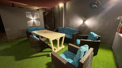 a dining room with a table and chairs and a table and chairsktop at T Cozy Chalet in Ash Shāghūr
