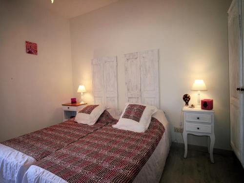 a bedroom with a bed with two pillows on it at Private Pool in Provence in La Motte